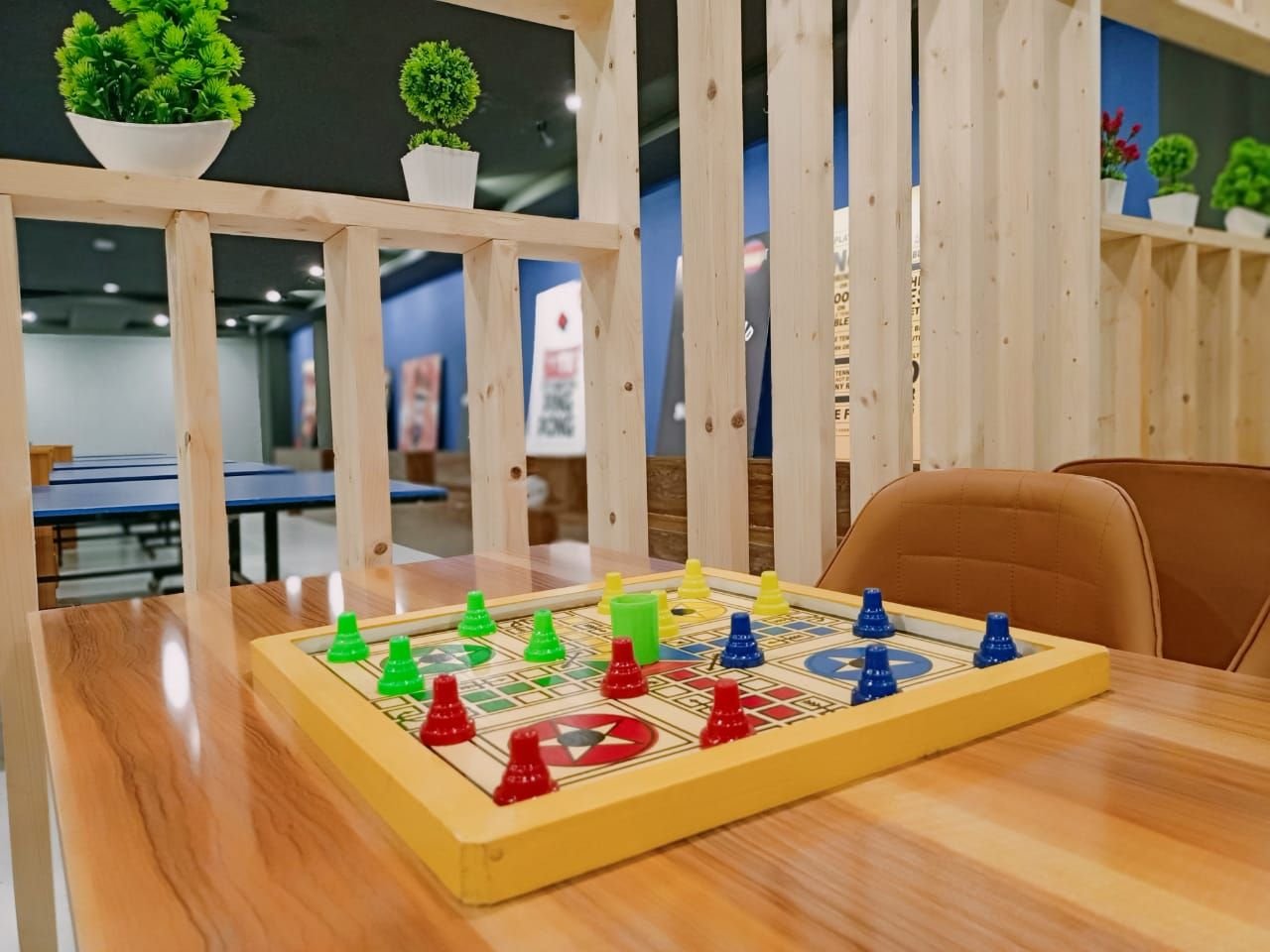 Ludo board in front of the tables